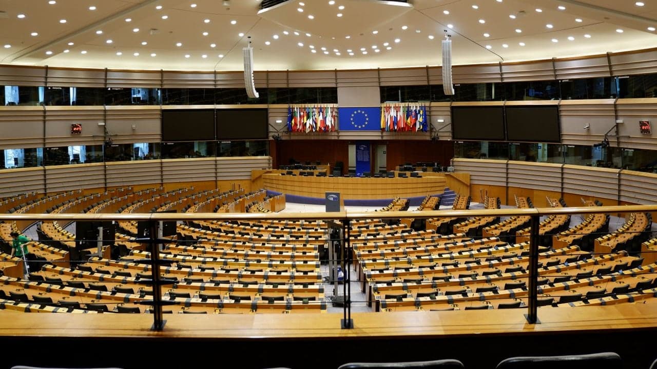 European Parliament hemicycle with the European Union flag